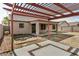Attractive backyard with a pergola, fire pit, and patio area at 3029 N 83Rd Ln, Phoenix, AZ 85037