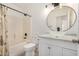 Bright bathroom with vanity, tub and shower combo at 3029 N 83Rd Ln, Phoenix, AZ 85037