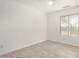 Bright bedroom with tile floors and a window at 3029 N 83Rd Ln, Phoenix, AZ 85037