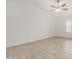 Bedroom featuring wood-look tile flooring and fan at 3029 N 83Rd Ln, Phoenix, AZ 85037
