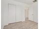 Bedroom with closet and wood-look tile floors at 3029 N 83Rd Ln, Phoenix, AZ 85037