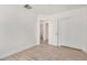 Well-lit bedroom with tile floors and a closet at 3029 N 83Rd Ln, Phoenix, AZ 85037