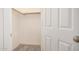 An open closet with neutral paint and hardwood floors at 3029 N 83Rd Ln, Phoenix, AZ 85037