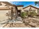Charming single-story home featuring a two-car garage, neutral paint, stone accents and mature landscaping at 3029 N 83Rd Ln, Phoenix, AZ 85037