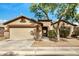 Charming single-story home featuring a two-car garage, neutral paint, stone accents and mature landscaping at 3029 N 83Rd Ln, Phoenix, AZ 85037