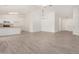 Bright living room showcasing a modern ceiling fan and beautiful wood-look tile flooring at 3029 N 83Rd Ln, Phoenix, AZ 85037