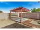 Backyard view of a pergola in a fenced yard at 3029 N 83Rd Ln, Phoenix, AZ 85037