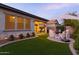 Outdoor space featuring a covered patio with outdoor dining, seating, and manicured landscaping at 3437 E Appaloosa Rd, Gilbert, AZ 85296