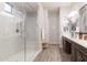 Bright bathroom features double vanity, marble shower, and stylish decor at 3437 E Appaloosa Rd, Gilbert, AZ 85296