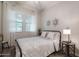 Bright bedroom features large windows and simple decor with a metal frame bed at 3437 E Appaloosa Rd, Gilbert, AZ 85296