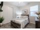 Bright bedroom featuring wood-look floors, white walls, and stylish decor with lots of natural light at 3437 E Appaloosa Rd, Gilbert, AZ 85296