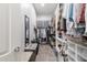 Walk-in closet provides ample storage with shelves and hanging racks for organization at 3437 E Appaloosa Rd, Gilbert, AZ 85296