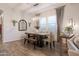 Tastefully decorated dining room with a rustic wood table and an inviting ambiance at 3437 E Appaloosa Rd, Gilbert, AZ 85296