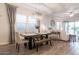Elegant dining area with modern lighting, stylish furniture, and windows for natural light at 3437 E Appaloosa Rd, Gilbert, AZ 85296