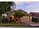 Home featuring a well-manicured front yard, stone accents, and a two-car garage at 3437 E Appaloosa Rd, Gilbert, AZ 85296