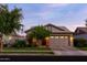 Charming home featuring a well-manicured front yard, stone accents, and a two-car garage at 3437 E Appaloosa Rd, Gilbert, AZ 85296