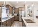 Well-appointed kitchen with stainless steel appliances, island with seating, and modern finishes at 3437 E Appaloosa Rd, Gilbert, AZ 85296