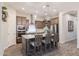 Gourmet kitchen with stainless steel appliances, granite countertops, and an island with bar seating at 3437 E Appaloosa Rd, Gilbert, AZ 85296