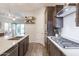 Bright, open kitchen featuring a center island, stainless appliances, and views into the living room at 3437 E Appaloosa Rd, Gilbert, AZ 85296
