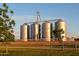 Community space featuring green grass, sidewalk, and four silos in the background at 3437 E Appaloosa Rd, Gilbert, AZ 85296