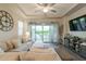 Cozy living room featuring a large sectional sofa, ceiling fan, and sliding doors to the backyard at 3437 E Appaloosa Rd, Gilbert, AZ 85296