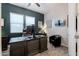 Office features a sleek dark desk, comfortable chair, and lots of space at 3437 E Appaloosa Rd, Gilbert, AZ 85296