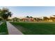 Lush park area featuring a playground, shaded picnic area, and walking path within the community at 3437 E Appaloosa Rd, Gilbert, AZ 85296