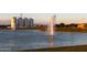 Scenic view of a tranquil community pond with a water feature and well-maintained surroundings at 3437 E Appaloosa Rd, Gilbert, AZ 85296