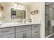 Bathroom with a quartz countertop and glass-enclosed shower at 3600 N Hayden Rd # 3405, Scottsdale, AZ 85251