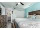 Bedroom featuring a ceiling fan, ensuite bathroom and closet with sliding doors at 3600 N Hayden Rd # 3405, Scottsdale, AZ 85251