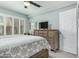 Bright bedroom with a large window with wood shutters and modern dresser at 3600 N Hayden Rd # 3405, Scottsdale, AZ 85251