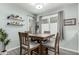 Cozy dining area with a wooden table and natural light from the windows at 3600 N Hayden Rd # 3405, Scottsdale, AZ 85251