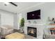Living room showcasing a fireplace, plant, and comfortable seating at 3600 N Hayden Rd # 3405, Scottsdale, AZ 85251