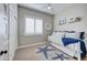 Cozy bedroom featuring a daybed, shuttered window, and nautical-themed decor at 3736 E Cotton Ct, Gilbert, AZ 85234