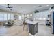 Open-concept kitchen featuring a large island, white cabinets, modern appliances, and seamless integration with the living area at 3736 E Cotton Ct, Gilbert, AZ 85234