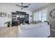 Inviting living room with a large white sofa, custom built-ins, and plenty of natural light at 3736 E Cotton Ct, Gilbert, AZ 85234