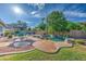 Beautiful backyard with a refreshing pool, well-manicured landscaping, a dining area and ample space for relaxation at 3736 E Cotton Ct, Gilbert, AZ 85234