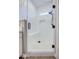 Walk-in shower showcasing white tile, built-in bench, and bronze fixtures at 3736 E Cotton Ct, Gilbert, AZ 85234