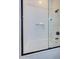 Modern tub and shower with sleek glass door and tiled walls at 3736 E Cotton Ct, Gilbert, AZ 85234