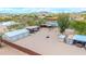 A desert property aerial view with horse pens, outbuildings, homes and desert landscaping at 37508 N 12Th St, Phoenix, AZ 85086