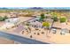 Wide aerial view of a desert property with home, desert landscaping, guest homes, outbuildings and more at 37508 N 12Th St, Phoenix, AZ 85086