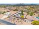 Sprawling desert property aerial view with a charming home, guest homes, outbuildings, and mature landscaping at 37508 N 12Th St, Phoenix, AZ 85086