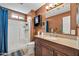 Bathroom features a vanity with a granite countertop and a shower-tub combination at 37508 N 12Th St, Phoenix, AZ 85086