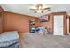 Bedroom with ceiling fan, wall-mounted TV, carpet, and natural light at 37508 N 12Th St, Phoenix, AZ 85086