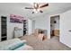 Neutral-toned bedroom features a ceiling fan, TV, and ample space at 37508 N 12Th St, Phoenix, AZ 85086