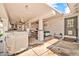 Spacious covered patio with a built-in grill and bar seating, perfect for outdoor entertaining and relaxation at 37508 N 12Th St, Phoenix, AZ 85086