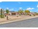 Spacious home with a gated driveway, desert landscaping, and solar panels on the roof at 37508 N 12Th St, Phoenix, AZ 85086