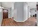 Foyer with hardwood floors, neutral paint, and a multi-paneled door at 37508 N 12Th St, Phoenix, AZ 85086