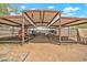Horse property featuring shaded stalls for horses, providing comfort and protection from the elements at 37508 N 12Th St, Phoenix, AZ 85086