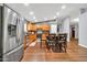 Bright kitchen featuring stainless steel appliances, wooden cabinets, and an adjacent dining area at 37508 N 12Th St, Phoenix, AZ 85086